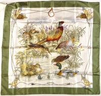 Lot 412 - A Gucci lady's silk headscarf depicting game...