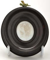 Lot 428 - An opaque white moulded glass relief portrait...