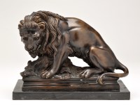 Lot 442 - A 20th Century cast bronze group of a lion...