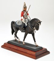 Lot 478 - A cast metal figure of a Life Guard, on...