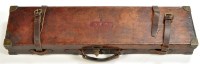 Lot 520 - A leather on wood shotgun case, with fitted...