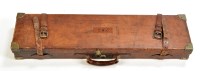 Lot 521 - A leather on wood shotgun case, fitted for a...