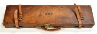 Lot 522 - A leather on wood shotgun case, fitted for a...