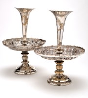 Lot 537 - Two late Victorian EPNS embossed table stands,...