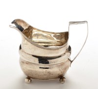 Lot 642 - A George III milk jug, by I.W., London 1809,...