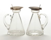 Lot 665 - A pair of George V glass and silver mounted...