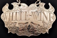 Lot 676 - A mid 18th Century silver escutcheon wine...