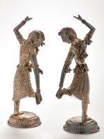 Lot 693 - A pair of Indian white metal figures of female...