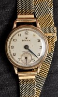 Lot 709 - Rolex Precision: a 1940's lady's 9ct. gold...