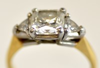 Lot 737 - A diamond ring, the central radiant cut...