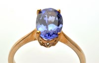 Lot 740 - A tanzanite ring, the oval facet cut tanzanite...