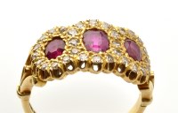 Lot 750 - A ruby and diamond triple cluster ring, set...