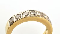 Lot 777 - A seven stone diamond half hoop eternity ring,...