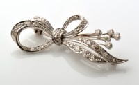 Lot 780 - A diamond set bow pattern brooch, set...