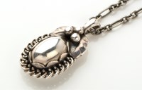 Lot 798 - Georg Jensen: a silver pendant of floral...