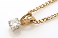 Lot 806 - A diamond solitaire pendant, the single...