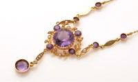 Lot 832 - An Edwardian amethyst, seed pearl and yellow...