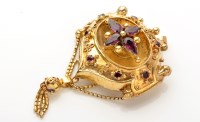 Lot 843 - An amethyst and yellow metal brooch, centred...