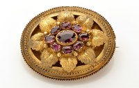 Lot 846 - A Victorian yellow metal and amethyst brooch,...