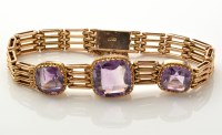 Lot 847 - A 9ct. yellow gold and amethyst bracelet, the...