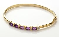 Lot 848 - A 9ct. yellow gold, amethyst and diamond...