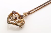 Lot 849 - A 9ct. yellow gold and amethyst set...