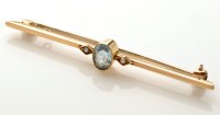 Lot 877 - An aquamarine and seed pearl bar brooch, the...