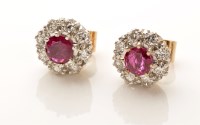 Lot 885 - A pair of diamond and ruby cluster stud...