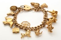 Lot 894 - A 9ct. yellow gold curb link charm bracelet,...