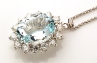 Lot 896 - An aquamarine and diamond cluster pendant, the...