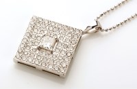 Lot 899 - A diamond pendant, the central princess cut...