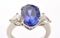 Lot 914 - A tanzanite and diamond ring, the oval facet...