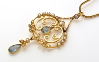 Lot 917 - An Edwardian pendant, set with aquamarine...