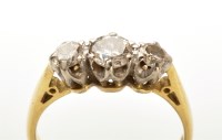 Lot 920 - A three stone diamond ring, the three...