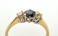 Lot 921 - A sapphire and diamond ring, the circular...