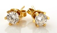 Lot 923 - A pair of diamond stud earrings, each earring...