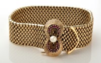 Lot 929 - A 9ct. yellow gold bracelet, of stitched...