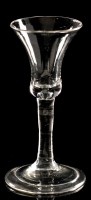 Lot 946 - Plain stem wine glass, the bell bowl with base...