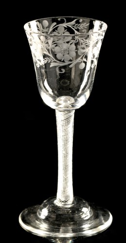 Lot 958 - Engraved air-twist wine glass, the round...