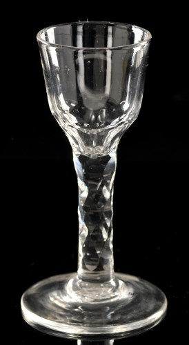 Lot 1007 - Faceted stem wine glass, the ogee bowl with...