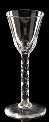 Lot 1008 - Faceted stem wine glass, the round funnel bowl...