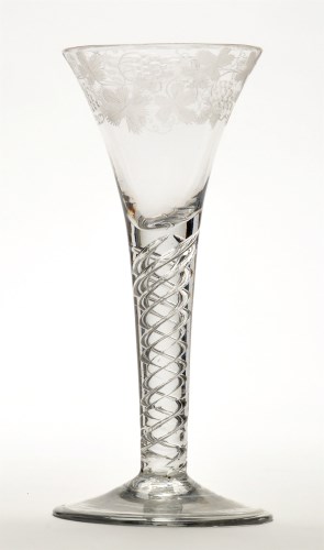 Lot 1031 - Engraved air-twist wine glass, the trumpet...