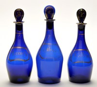 Lot 1056 - Three 'Bristol' blue glass decanters and...