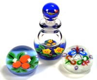 Lot 1066 - Two glass paperweights by John Deacons, and...