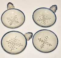 Lot 1111 - Four Pearlware strainers, of pierced circular...