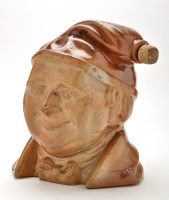 Lot 1120 - Large saltglaze stoneware character flagon, in...