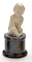 Lot 1134 - Royal Doulton stoneware figure of a boy on...