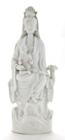 Lot 1220 - Chinese Dehua figure of Guan Yin, with child...