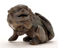 Lot 1279 - Chinese bronze figure of a fo dog, looking to...