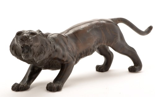 Lot 1301 - Japanese bronze figure of a roaring tiger,...